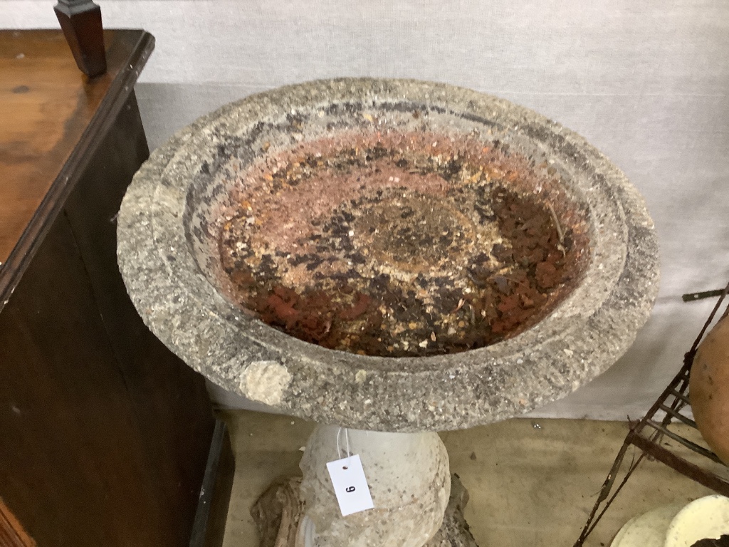 A reconstituted stone garden bird bath, diameter 42cm, height 80cm